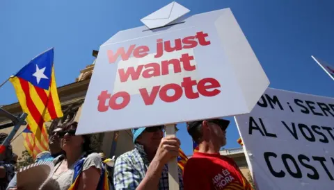 Reuters People hold banners during a pro-independence rally in Barcelona, Spain June 11, 2017.