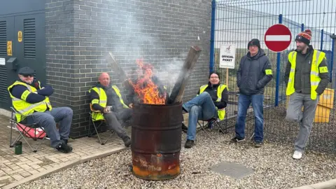 Five Go North East workers on a picket line at the firm's Consett depot on Saturday