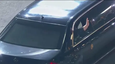 Reuters Mr Kim waves as he returns to North Korea