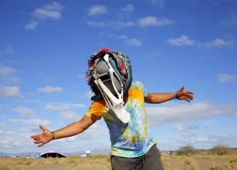 EPA A festivalgoer Jaco Maritz, wears his hand made face mask made out of bones during the annual Afrikaburn Festival held in the Tankwa Karoo, Calvinia, South Africa, 24 April 2018