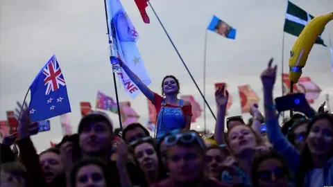 Reuters Revellers at this year's Glastonbury Festival