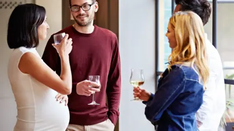 Getty Images Pregnant woman drinking water