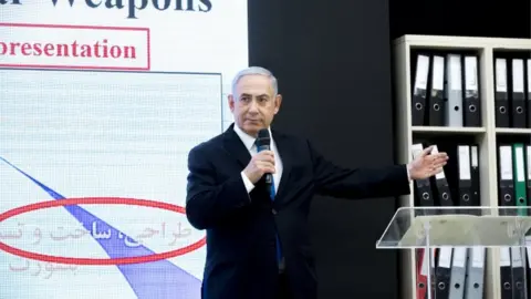 EPA Israeli Prime Minister Benjamin Netanyahu on stage presenting documents allegedly stolen from Iran's nuclear archives