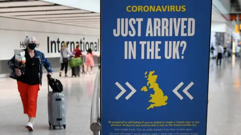 EPA Passengers arrive at Heathrow airport