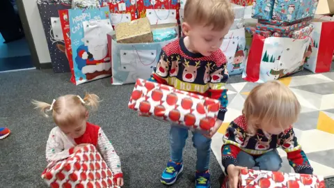 Faces Children with gifts