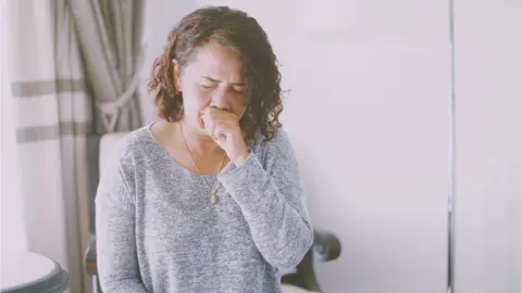 Getty Images file picture of someone coughing