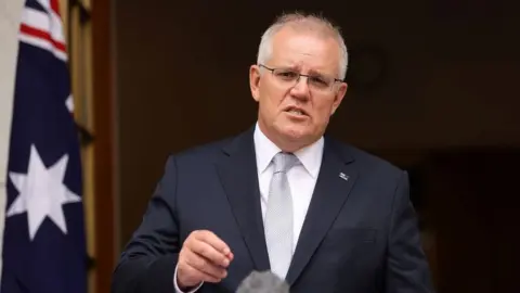Getty Images Prime Minister Scott Morrison speaking to the media
