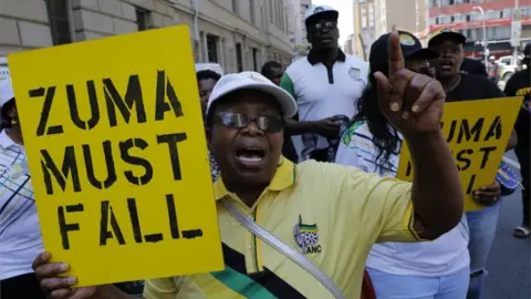 EPA Members an ANC faction supporting Cyril Ramaphosa call for Jacob Zuma, to resign, in Johannesburg on 5 February 2018
