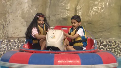 Children enjoying a fairground ride