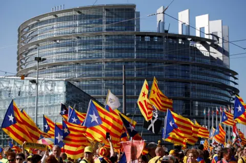 Reuters Catalan pro-independence "Estelada" flags and banners during a demonstration at the European Parliament on July 2 , 2019