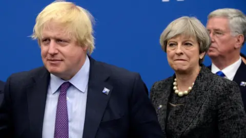 EPA Boris Johnson and Theresa May