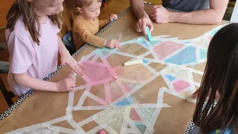 Family photo Katrin's children doing school work