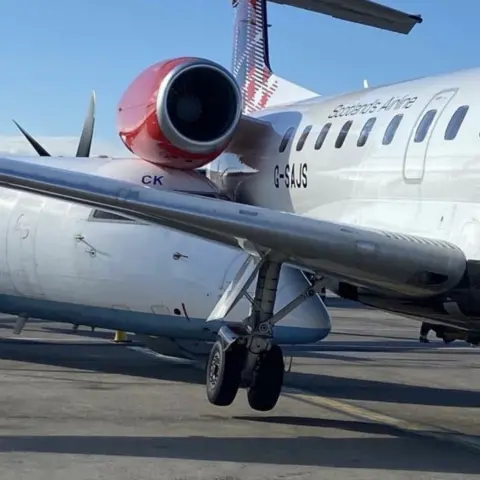 Planes wedged together after collision at Aberdeen Airport