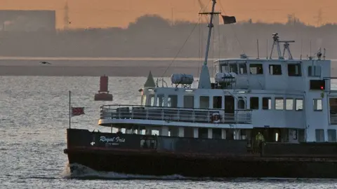 PA Media A flag on the Royal Iris Mersey ferry flies at half mast in memory of Gerry And The Pacemakers star Gerry Marsden