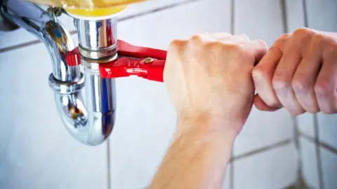 Getty Images Plumbing a sink