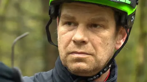 Dr Roderick Bale with one of the nails