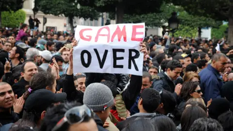 Getty Images Protestors at an anti-Ben Ali rally in 2011