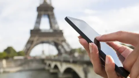 Getty Images Eiffel tower and mobile phone