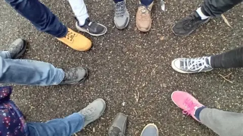 Rachel Rayner Walkers' feet in a circle