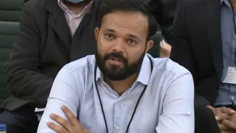 PA Media former Yorkshire cricketer Azeem Rafiq, speaking to a committee of MPs