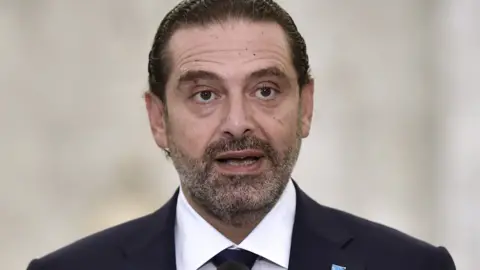 EPA Saad Hariri speaks to reporters at the Baabda palace on 22 October 2020