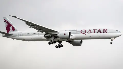 EPA A Qatar Airways plane in flight