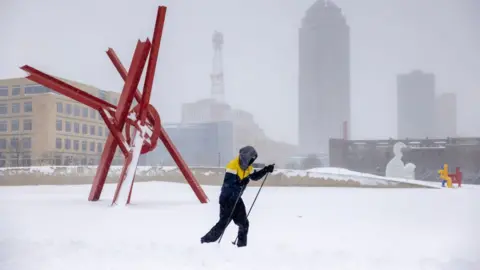 Getty Images A cross-country skier at the Sculpture Park during a winter storm ahead of the Iowa caucus in Des Moines, Iowa