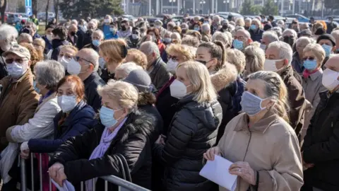 Reuters People wait to receive the Pfizer-BioNTech COVID-19 vaccine as the country begins mass vaccination for the coronavirus disease (COVID-19), in Belgrade, Serbia, February 3, 2021