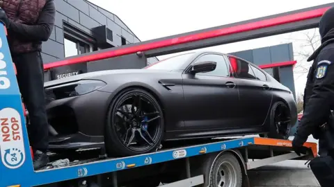 Romanian police seize luxury vehicle from Andrew Tate's compound