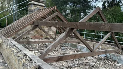 Emma Baugh/BBC Roof timbers at the station