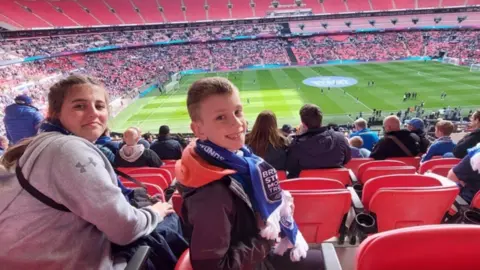 Family photo Emilia and Jakub at the match