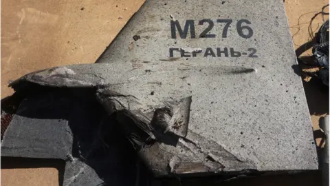 Reuters Wreckage of a Shehad-136 drone. The tail fin has Geranium 2 written on it - the Russian name for the drone.