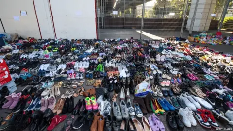 Getty Images Vast amounts of shoes have been donated.