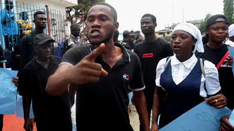 EPA Liberians stage a rally for justice in front of the Liberia National Police headquarters in Monrovia.