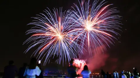 EPA Fireworks illuminate the sky over the Yas Marina on the third day of the Muslim holiday of Eid Al-Fitr at the Marina on Yas Island, Abu Dhabi, United Arab Emirates,