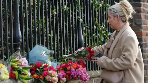 PA Media Flowers left outside the home of Vivienne Westwood