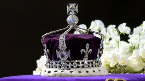 Getty Images The coronation crown of the Queen Mother sits on top of her coffin.