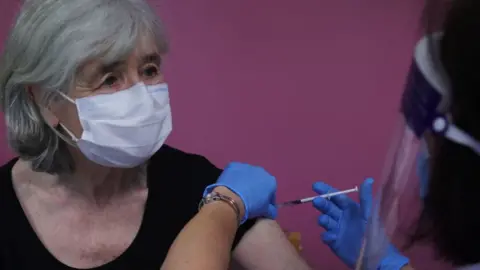 Getty Images Woman gets vaccine