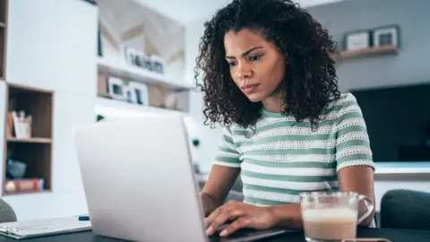 Getty Images A woman using a computer