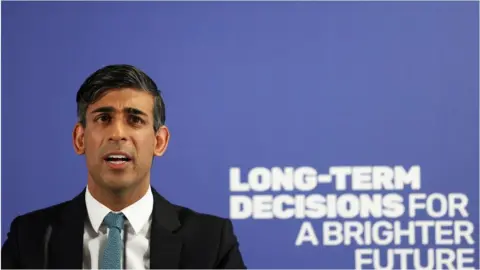 Reuters Rishi Sunak giving a speech in Enfield