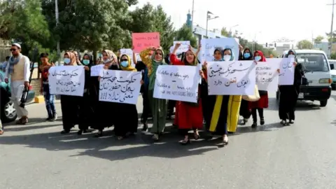 Shamshad News via Reuters Women protest in Mazar-e-Sharif on Monday