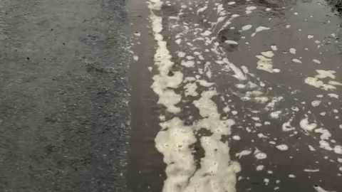 Abergwili Anglers Club Slurry flowing down a road