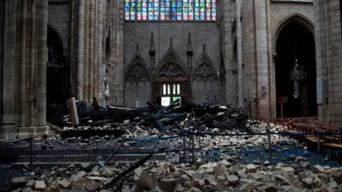 AFP/Getty Debris on the floor of Notre-Dame cathedral after a fire tore through the building, April 2019