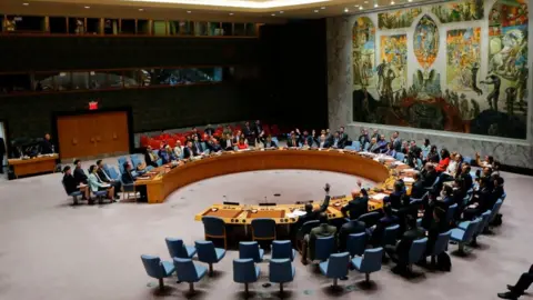 Getty Images UN Security Council members vote on a US-drafted resolution toughening sanctions on North Korea, at the United Nations Headquarters in New York, on 5 August 2017