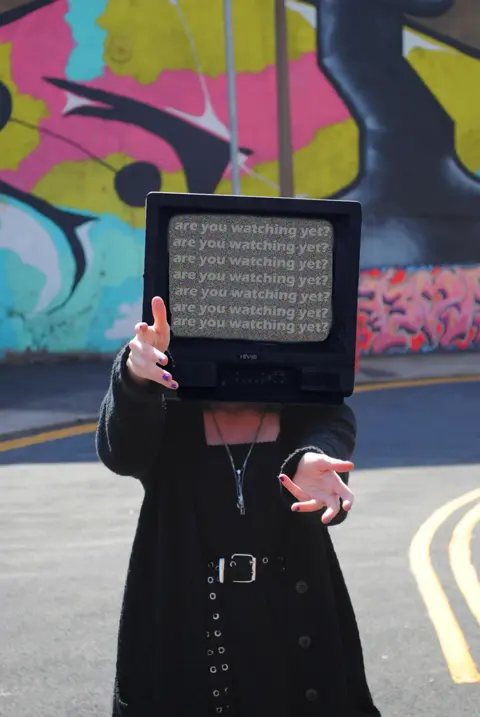 Maddy Coleman A piece of art showing a photo of a woman with a television set for a head