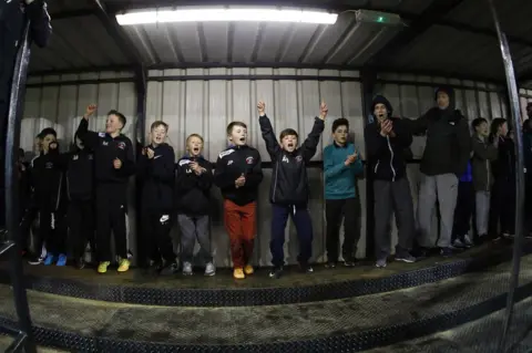 Paul Thompson Fans celebrate a goal