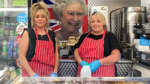 Dawn Gerber/BBC Cheryl Jennings and team member on the food stall at Cornhill