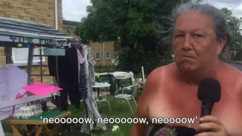 Jean Brooks imitating the sound of a speeding biker