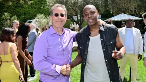 Stefanie Keenan/Getty Dave Chappelle alongside fellow comedian Jerry Seinfeld on Sunday, at a lunchtime event for the same Netflix Is a Joke Festival