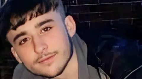 BBC Owen Dunn, 18, smiling at the camera